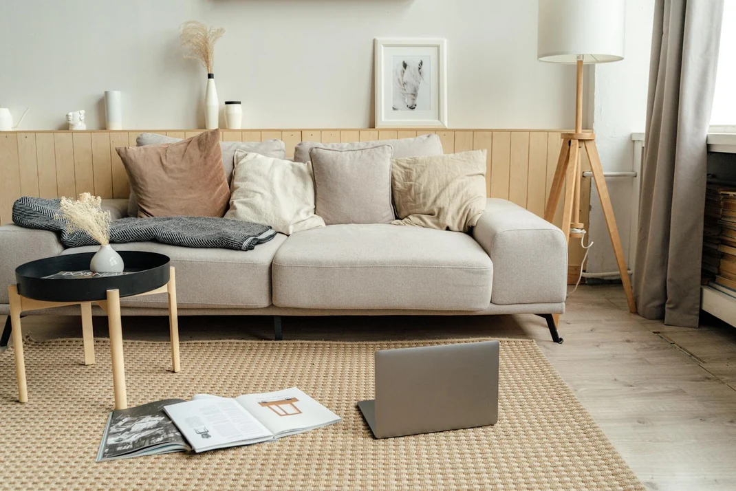 Warm layered living room featuring rug throw and wall art